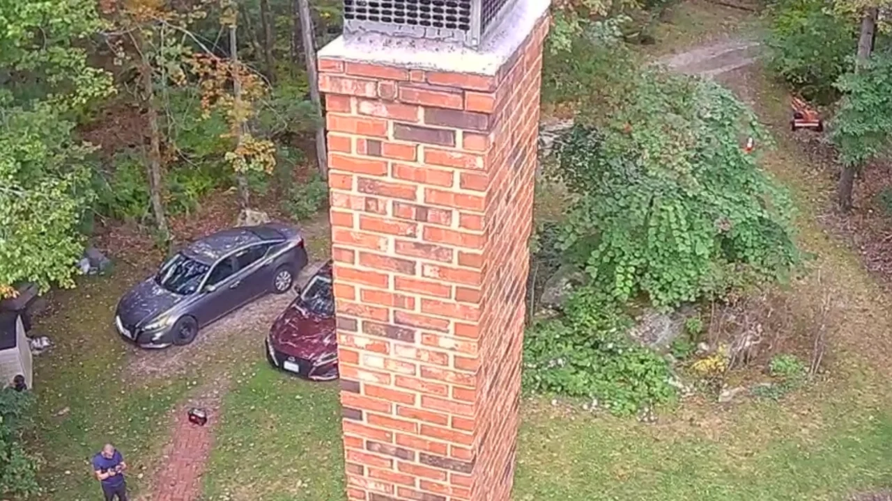 Detailed view of a brick chimney and protective cap